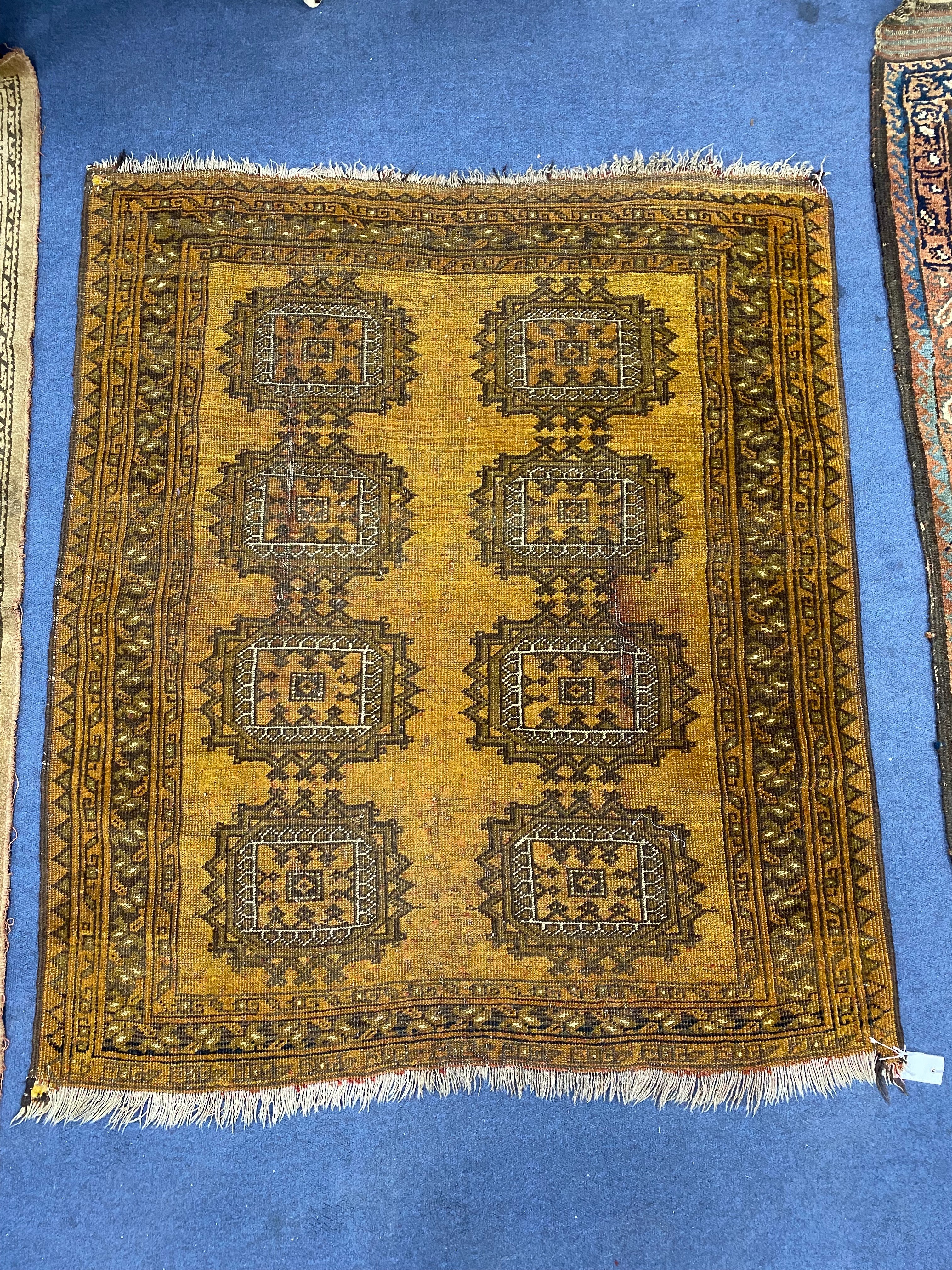 A Bokhara design mustard ground rug, 120 x 103cm together with another rug
